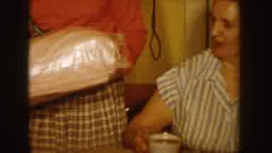 Idaho (1955): A Woman Carrying Two Presents To Another Girl For Her Birthday