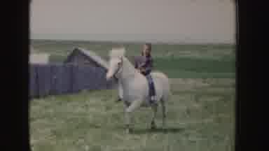 Idaho (1955): A Man Riding On A Horse In The Bright Day Time On A Ranch