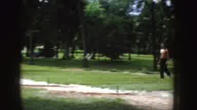 Idaho (1955): People Throwing Pitch In Grassy Park Surrounded By Trees