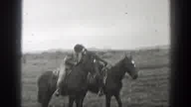 Montana (1939): Man And Woman Riding Horses Together Holding Hands And Kissing