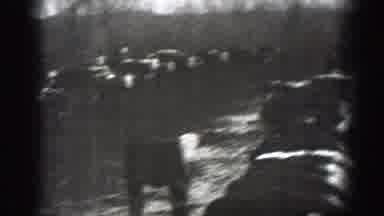 Montana (1939): Black And White Cows Eating Hay On Cow Farm With Two Figures In