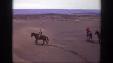 Montana (1939): Three People Riding Horses In The Middle Of The Dry Desert