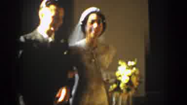 Montana (1939): A Bride And Groom Walking Arm In Arm Together At A Wedding