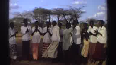 Sudan (1969): A Group Of Men Clapping And Singing For Their Friends Who Are