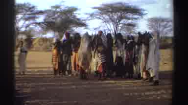 Sudan (1969): Black People Gathered In A Circle Singing Raising Their Hands And