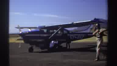 Sudan-1969: People Loading Luggage Into A Small Light Single Propeller Aircraft