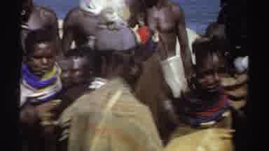 Sudan (1969): Black Natives Dressed In Cultural Clothing Dance Next To A Large