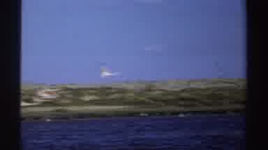 Sudan (1969): Flock Of Birds With Black Feathers On Wings Flies Over Body Of Water