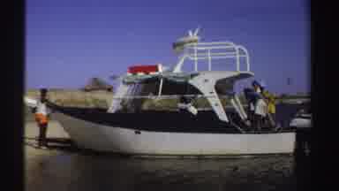 Sudan (1969): People Gathered In A Boat On The Shore