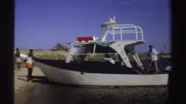 Sudan (1969): Lifeguard Boat On Shore With Two People On Beach And Two People On