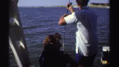 Sudan (1969): A Man Fishes With A Woman On The Ocean Near Shore