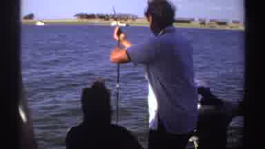 Sudan (1969): A Group Of People Fishing From A Boat On A Body Of Water