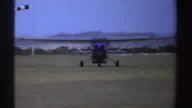 Sudan (1969): Blue And White Airplane Rolls On Green Field On A Clear Day