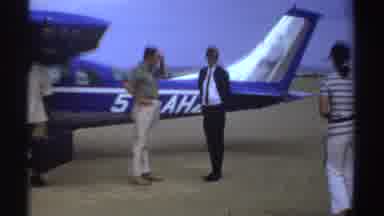 Sudan (1969): People Boarding Plane Loading Luggage Walking Sunglasses Suit