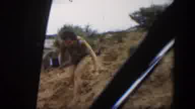 Utah (1951): A Natural Arch In The Desert With A Person Stepping Downhill