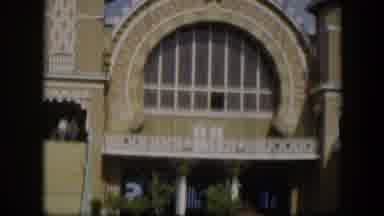 Utah (1951): View Of Circular Window In Tan Building On A Sunny Day