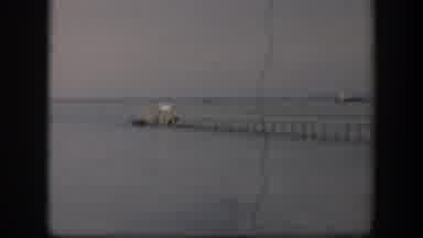Utah (1951): A Wooden Dock Stretches Into A Body Of Water Where A Boat Is Tied To