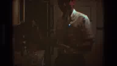 Toledo Ohio (1968): A Smiling Man Picks Up Two Bottles Of Alcohol And Carries Them
