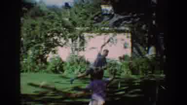 Toledo Ohio (1968): Children Play With Rackets In The Shade Of Trees In The