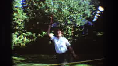 Toledo Ohio (1968): Two Grandfathers Playing Badminton On A Garden