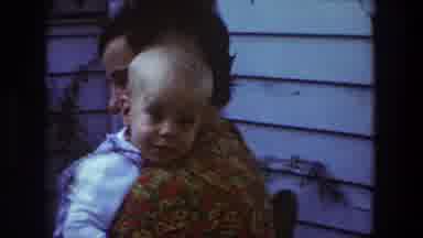 Toledo Ohio (1968): A Woman Holding A Baby And Smiling At The Camera