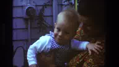 Toledo Ohio (1968): Trying To Teach Baby Boy To Clap While Mom Holds Him