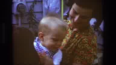 Toledo Ohio (1968): A Happy Baby Is Clapping Its Hands In The Arms Of His Loving