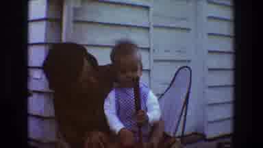 Toledo Ohio (1968): A Mother Playing With Her Baby As He Holds On To His Toy