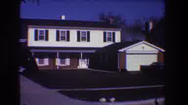 Toledo Ohio (1968): View Of Brown And White House With Blue Sky On A Clear Day