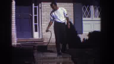 Toledo Ohio (1968): A Man Washing And Cleaning His House Outside
