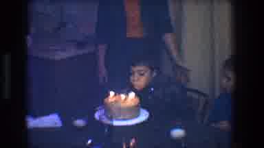 Toledo Ohio (1968): Boy Wearing Brown Shirt Blows Out Candles On Brown Cake