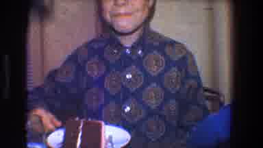 Toledo Ohio (1968): Kid Enjoys Cake As He Looks Into The Camera