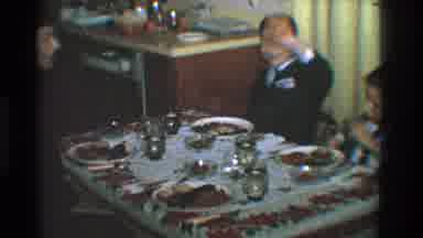 Toledo Ohio (1968): Two Kids Having Food On The Dining Table With Spectators