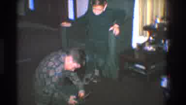 Toledo Ohio (1968): Boy Tapes Wood Hockey Stick While Second Boy Watches Inside A