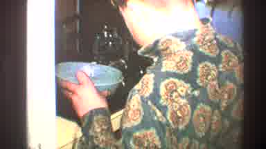 Toledo Ohio (1968): Man In Patterned Shirt Standing In Kitchen And Scooping Food