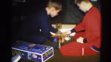 Toledo Ohio (1968): Boys Sitting On The Floor Playing Game Boy Sitting At The