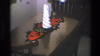 Toledo Ohio (1968): Wooden Table With A White Candle Under A Colorful Crochet