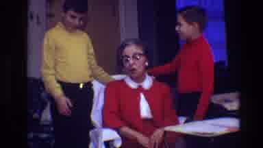 Toledo Ohio (1968): Two Boys Wearing Red And Yellow Shirts Stand Next To Woman