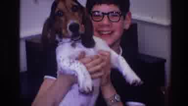Toledo Ohio (1968): Boy With Glasses Playing With Dog And Smiling