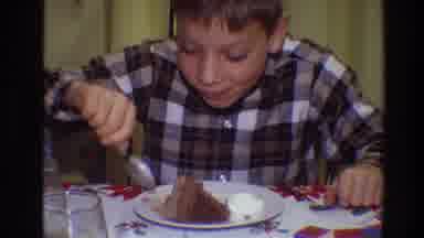 Toledo Ohio (1968): A Boy Seated At A Dining Table Eats Cake From A Plate With
