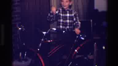 Toledo Ohio (1968): Young Boy In Plaid Shirt Showing Off His Red Bicycle And