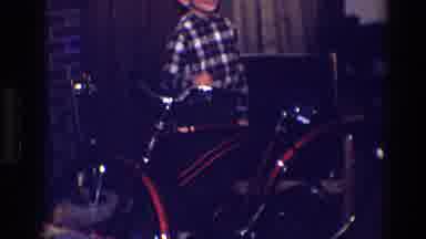 Toledo Ohio (1968): Boy Wearing Brown Plaid Shirt Stands Next To Red Bicycle
