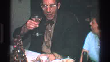 Toledo Ohio (1968): Man Picks Up His Glass To Toast Then Turn To The Woman Sitting