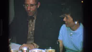 Toledo Ohio (1968): A Man Wearing A Suit And Bow Tie Sits Next To A Woman Followed