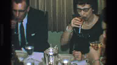 Toledo Ohio (1968): People Gathered At A Table Eating And Drinking Kissing Their