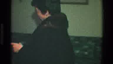 Toledo Ohio (1968): Man Woman Walking Inside The House Making A Sign With His