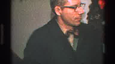 Toledo Ohio (1968): Man Wearing Glasses And Black Jacket Stands In Front Of