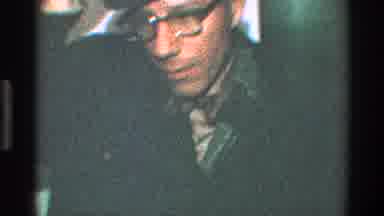 Toledo Ohio (1968): Man With A Hat And Glasses Says Goodbye To His Wife With A
