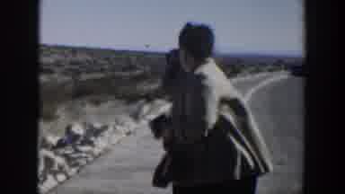 Texas (1951): Two People Taking Pictures On A Road Probably In A Paradisiacal