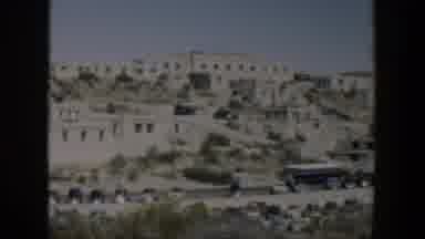 Texas (1951): View Of White Buildings And Green Trees On A Bright Sunny Day